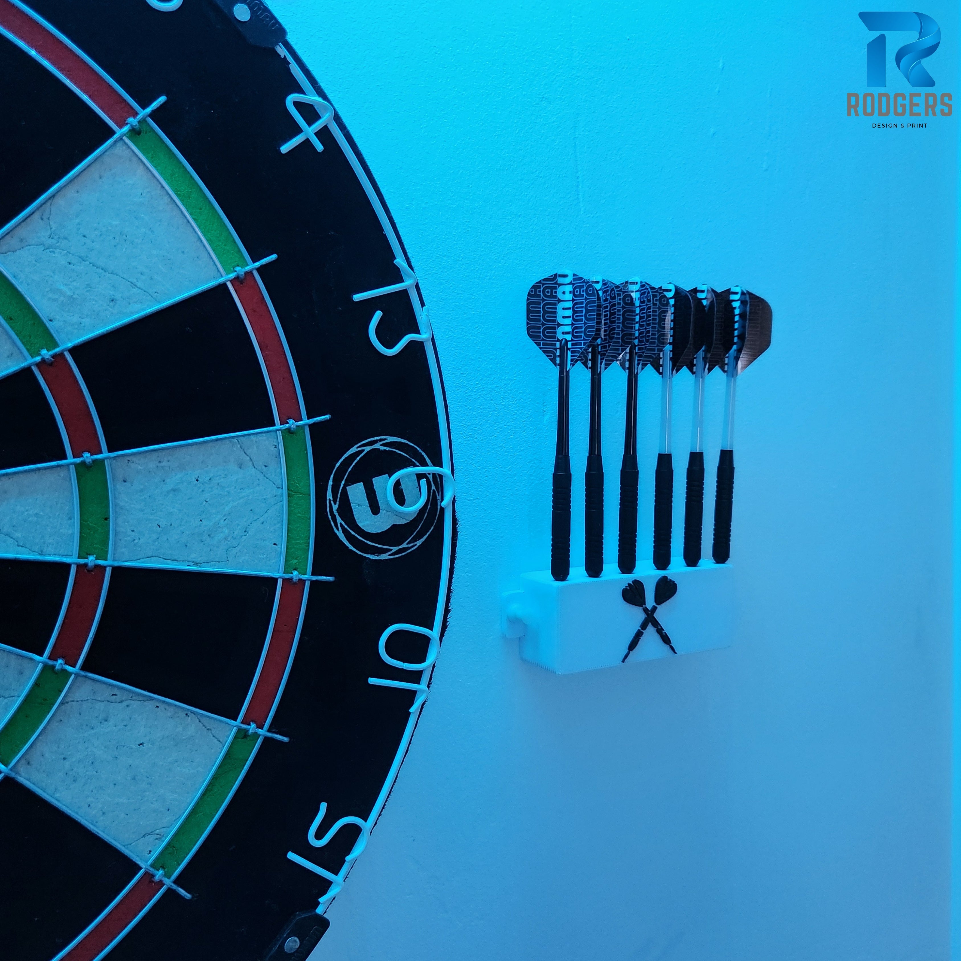 White wall-mountable dart holder securely holding six darts